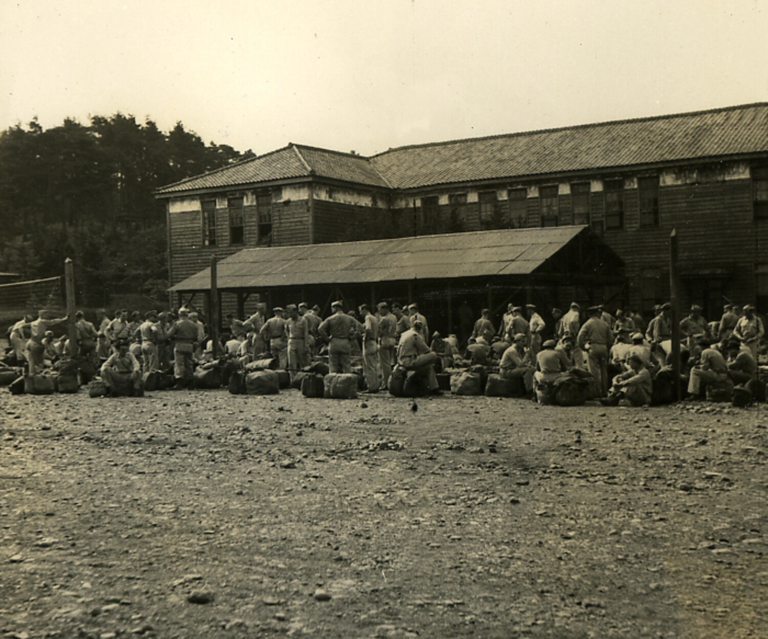 U.S. Servicemen Assembled with Duffel Bags at Former Japanese Barracks, Occupation-era Japan