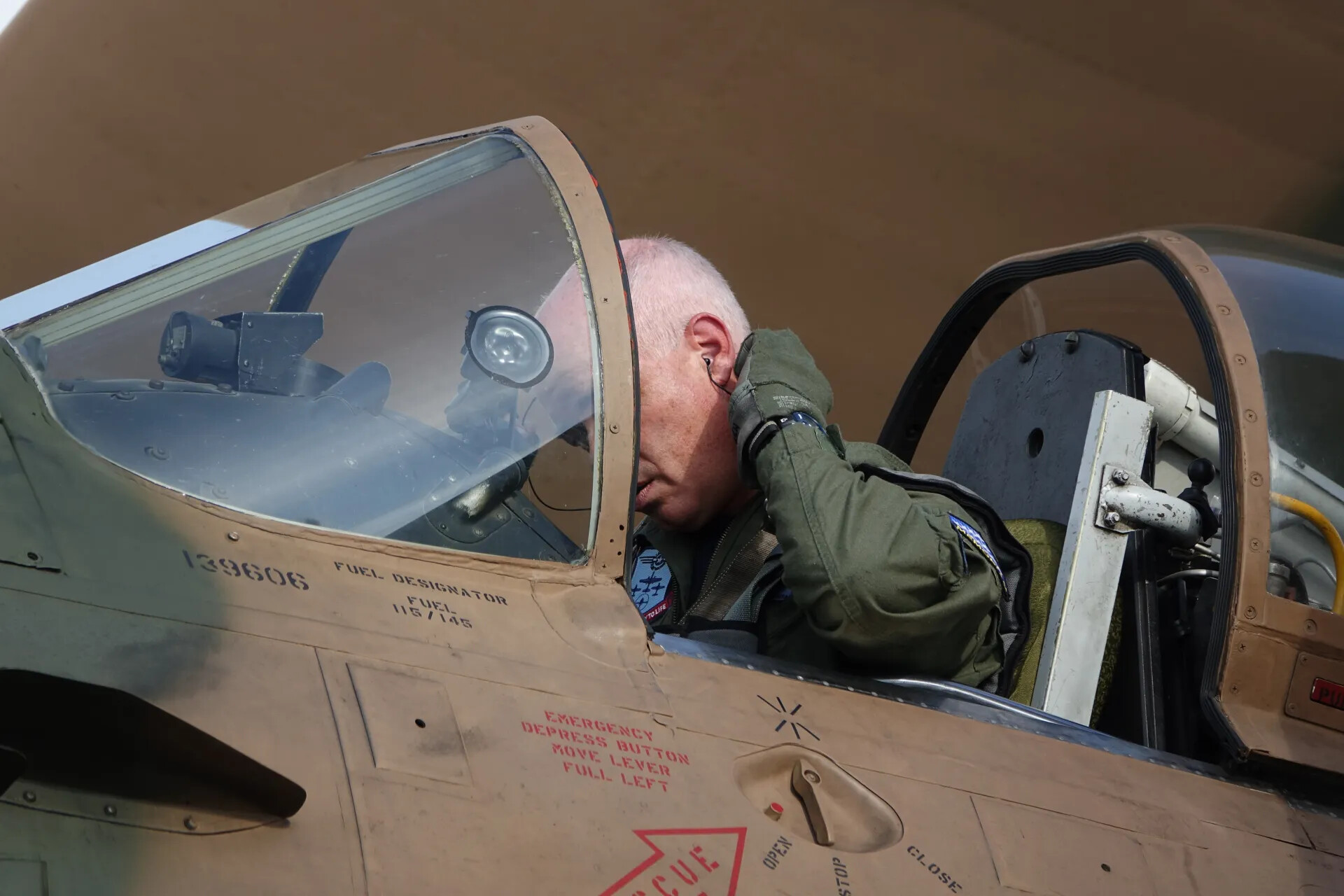 Veteran Pilot in A-1 Skyraider Cockpit, Reflective Moment