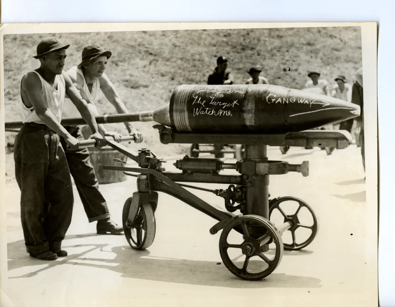 Gun Crew Loading Chalk-Marked Heavy Shell onto Shell Truck, Gunnery Range