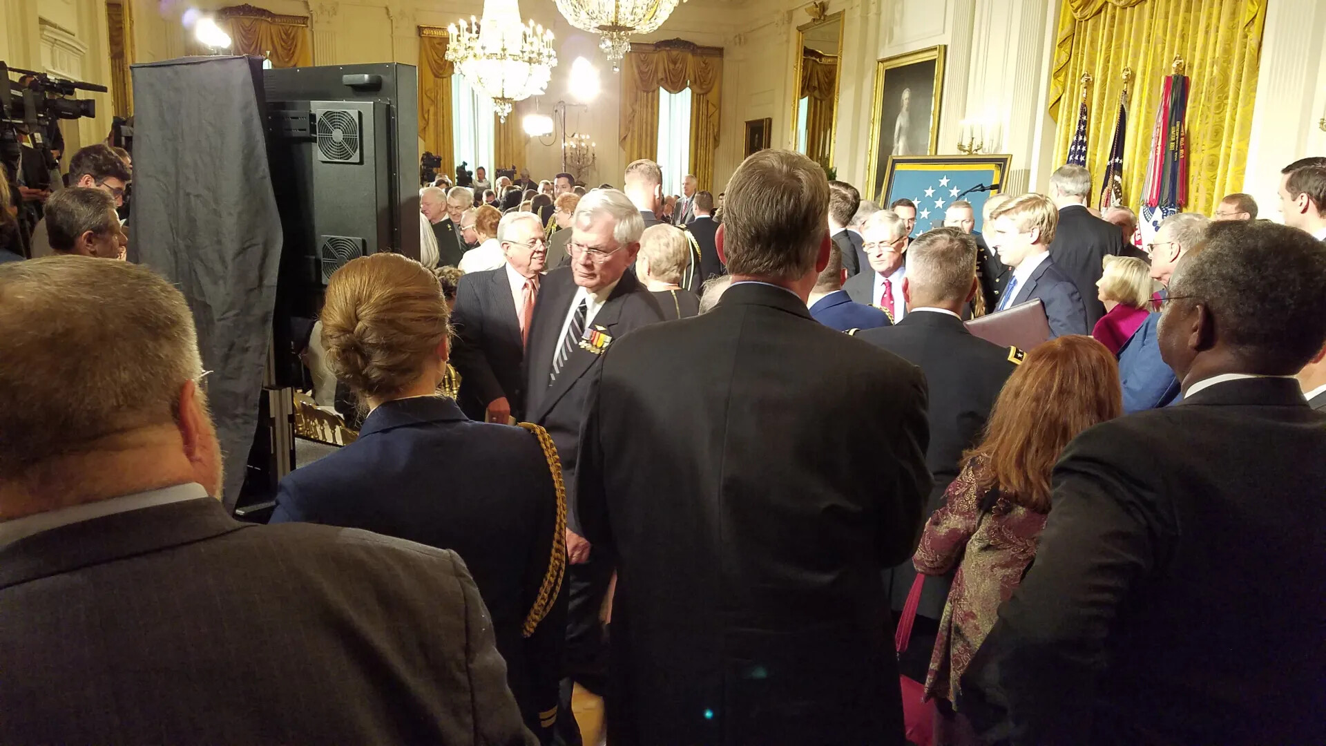 Crowd and Press in White House East Room Before Medal of Honor Ceremony for Gary Michael Rose, October 23, 2017