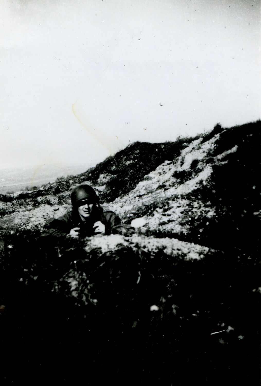 US Soldier in M1 Helmet Observing from Snow-Covered High Ground, Likely European Theater, WWII