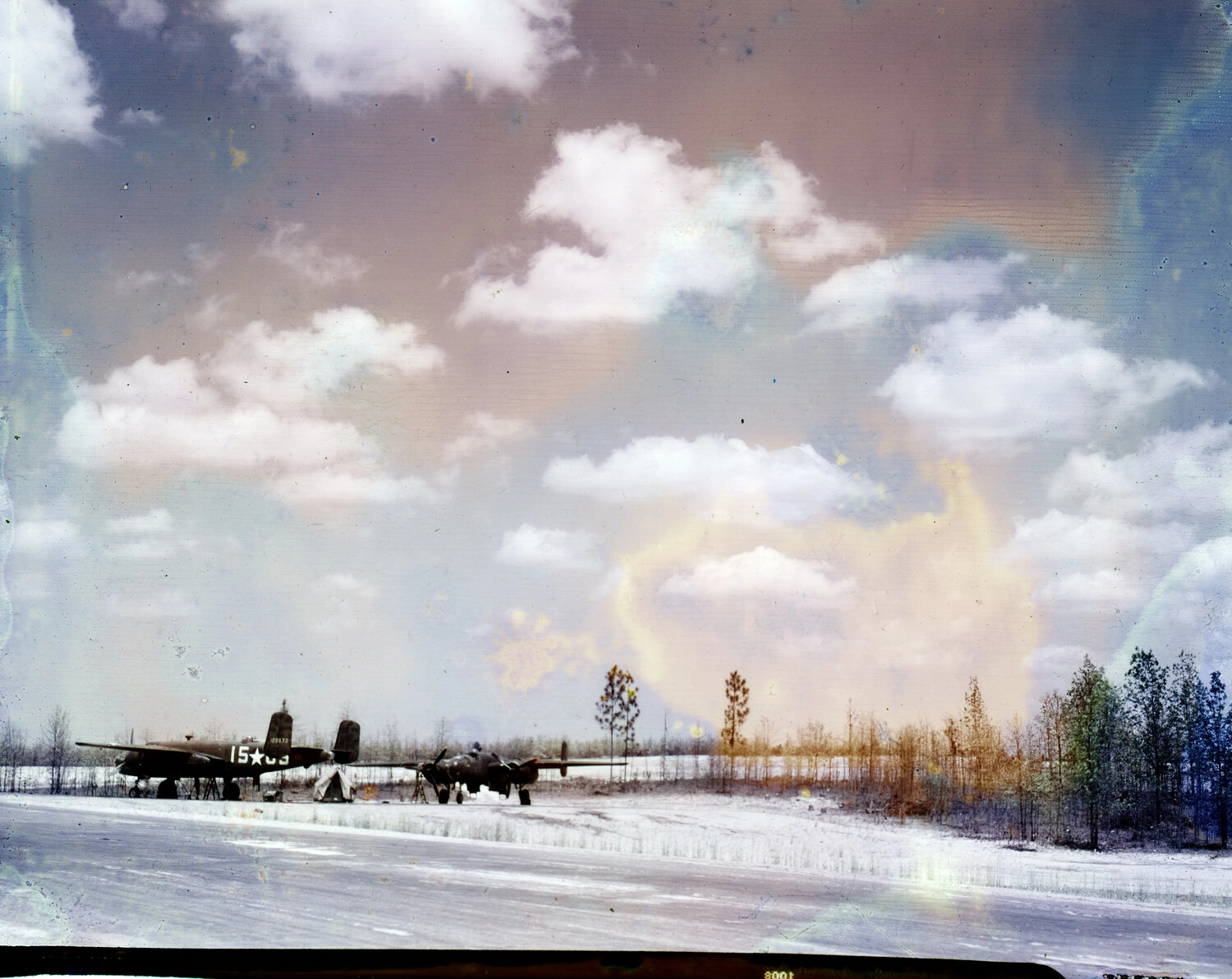 Damaged WWII Negative: Twin-Engine Bombers on Snow-Covered Airfield, CBI Theatre Collection