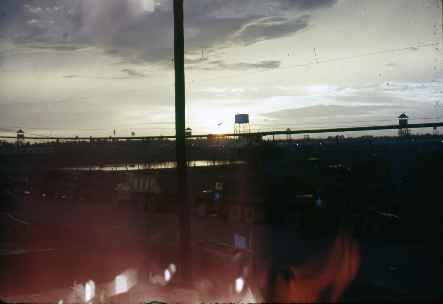 Sunset Over Motor Pool and Guard Towers, U.S. Base in Vietnam