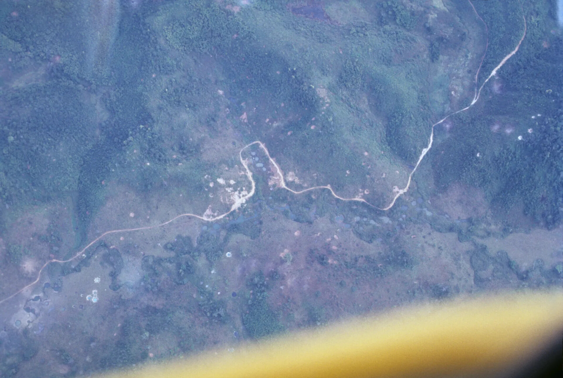 Aerial Reconnaissance View of Rural Terrain with Roads and Cratering, Vietnam