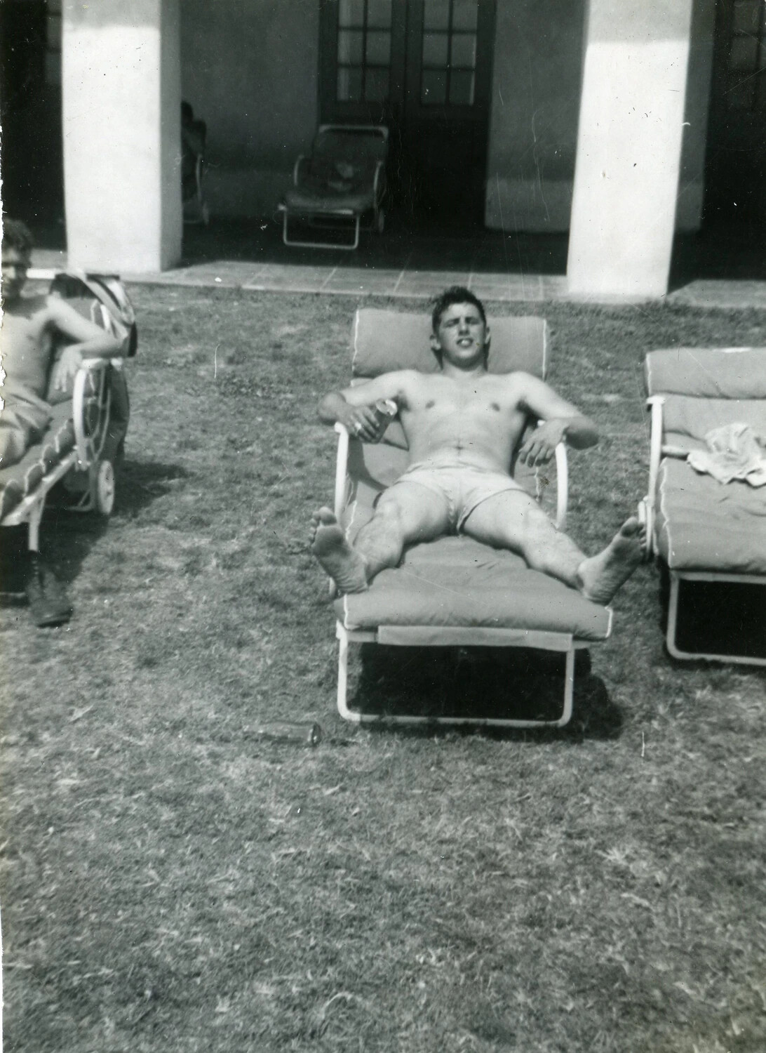 Marine Aviator Relaxing on a Lounge Chair at a Rest Facility, VMF-214 Album, 1945