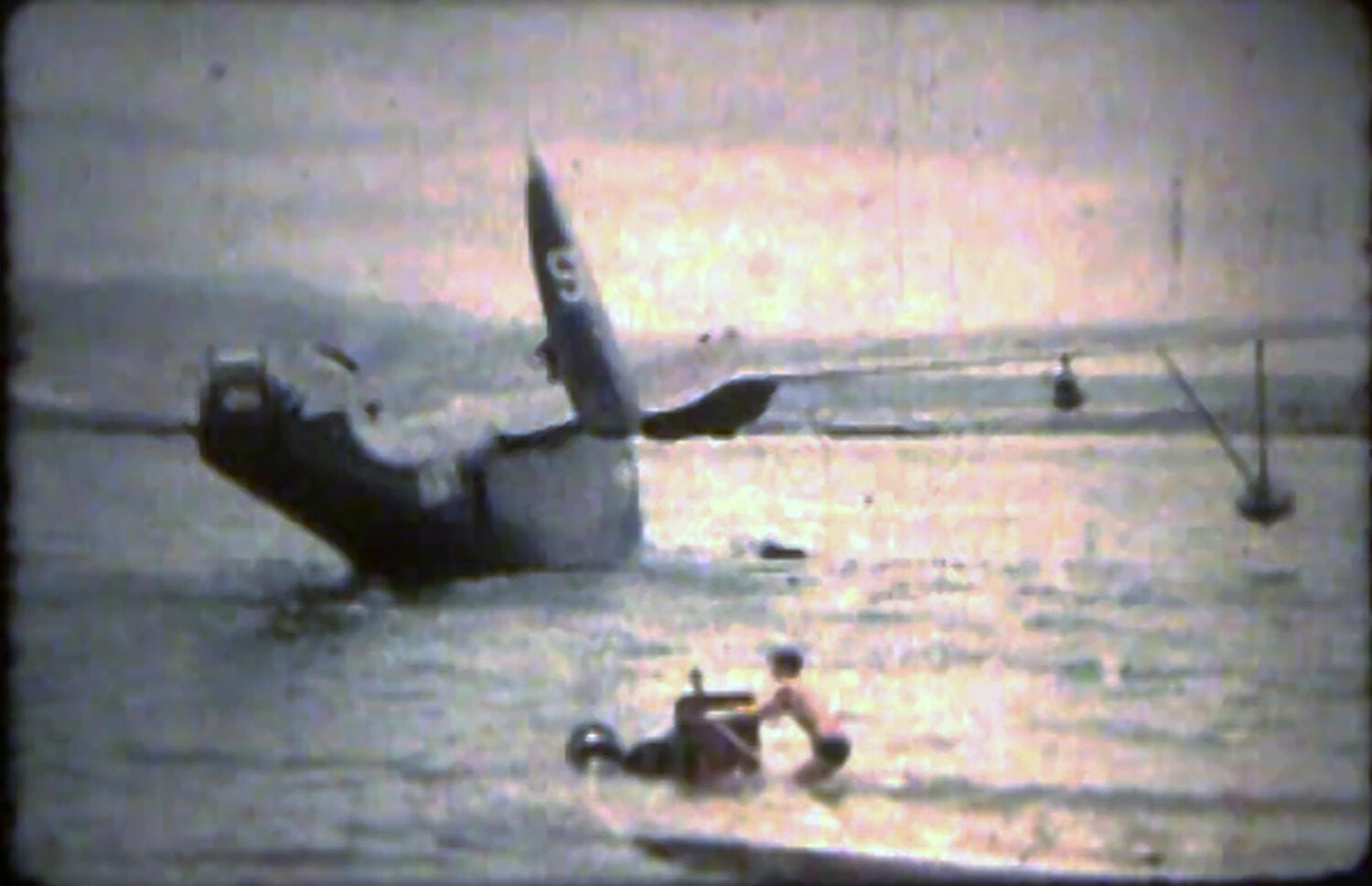 Aircraft Ditched in Kaneohe Bay, Tail Section Visible — Korean War Era