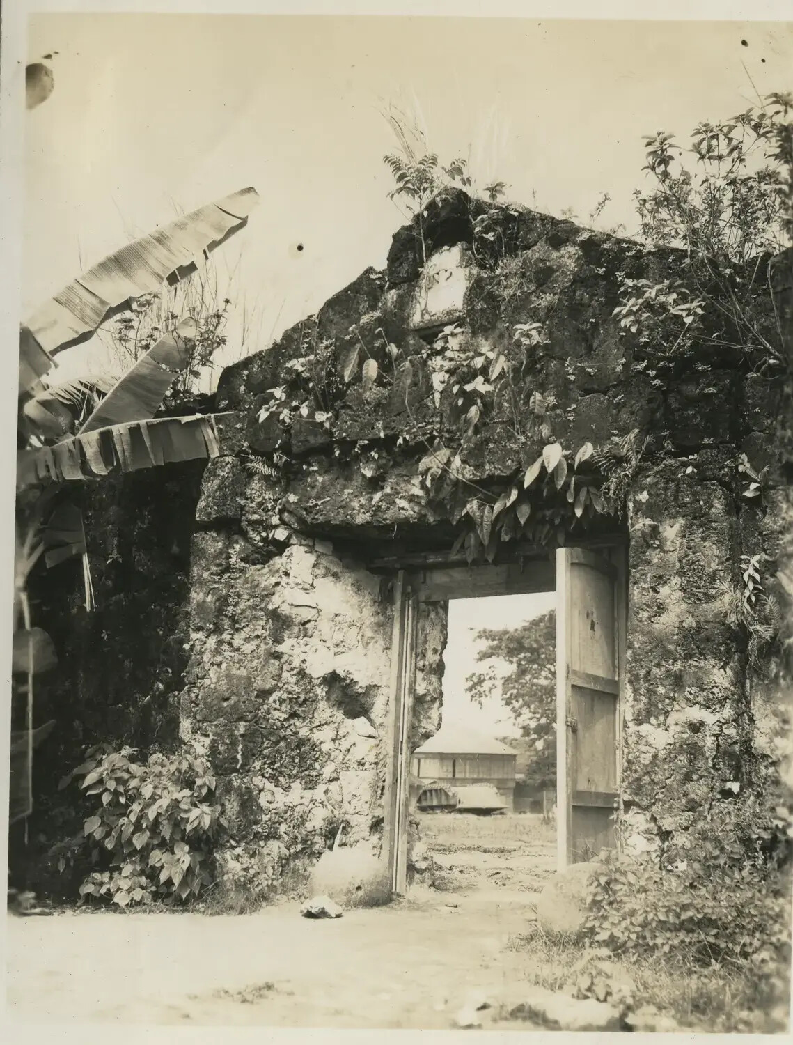 Ruined Stone Gateway with Military Vehicle Beyond, Philippines — 312th Bomb Group Personal Photograph