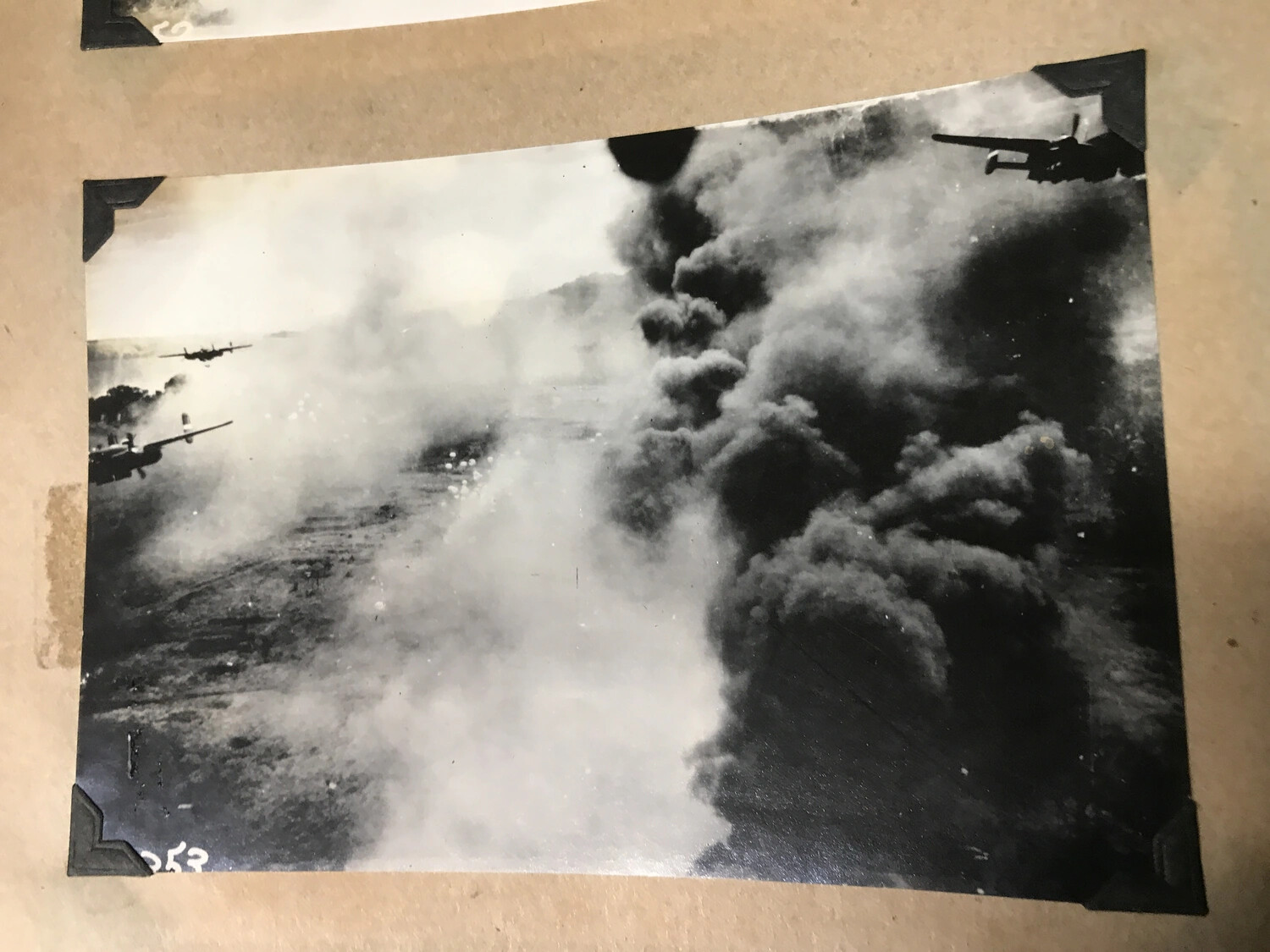 Scrapbook Photograph No. 253: Dense Smoke Column During Dagua Airfield Strike