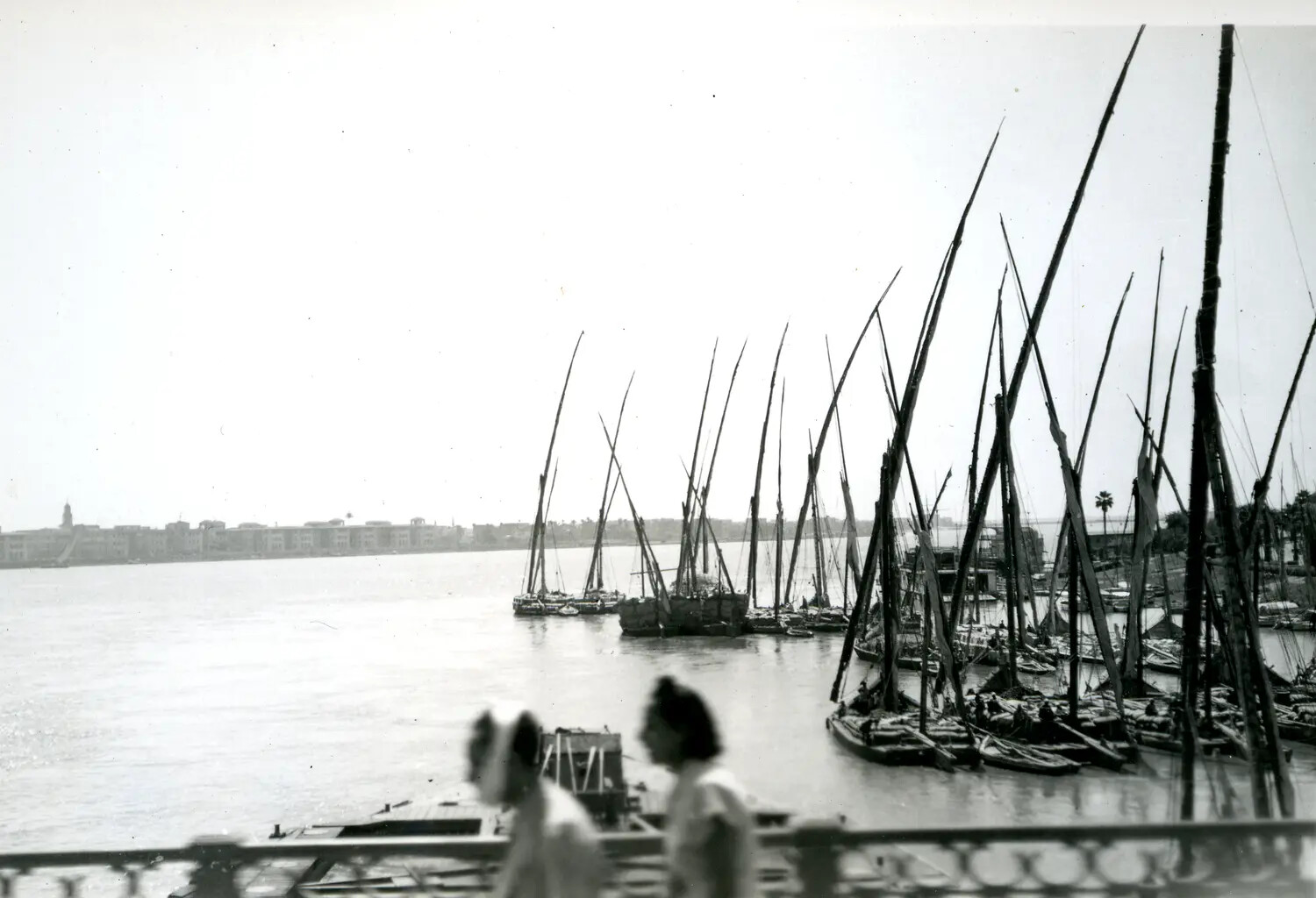 Riverfront Harbor with Lateen-Rigged Sailing Vessels - Likely Nile River, Egypt, WWII-Era Transit Photograph