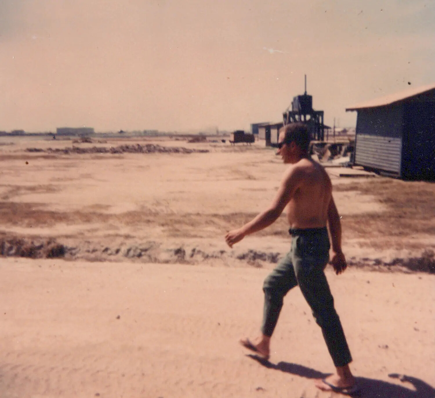 American Serviceman Walking Through Base Camp, Cu Chi, Vietnam, 1967