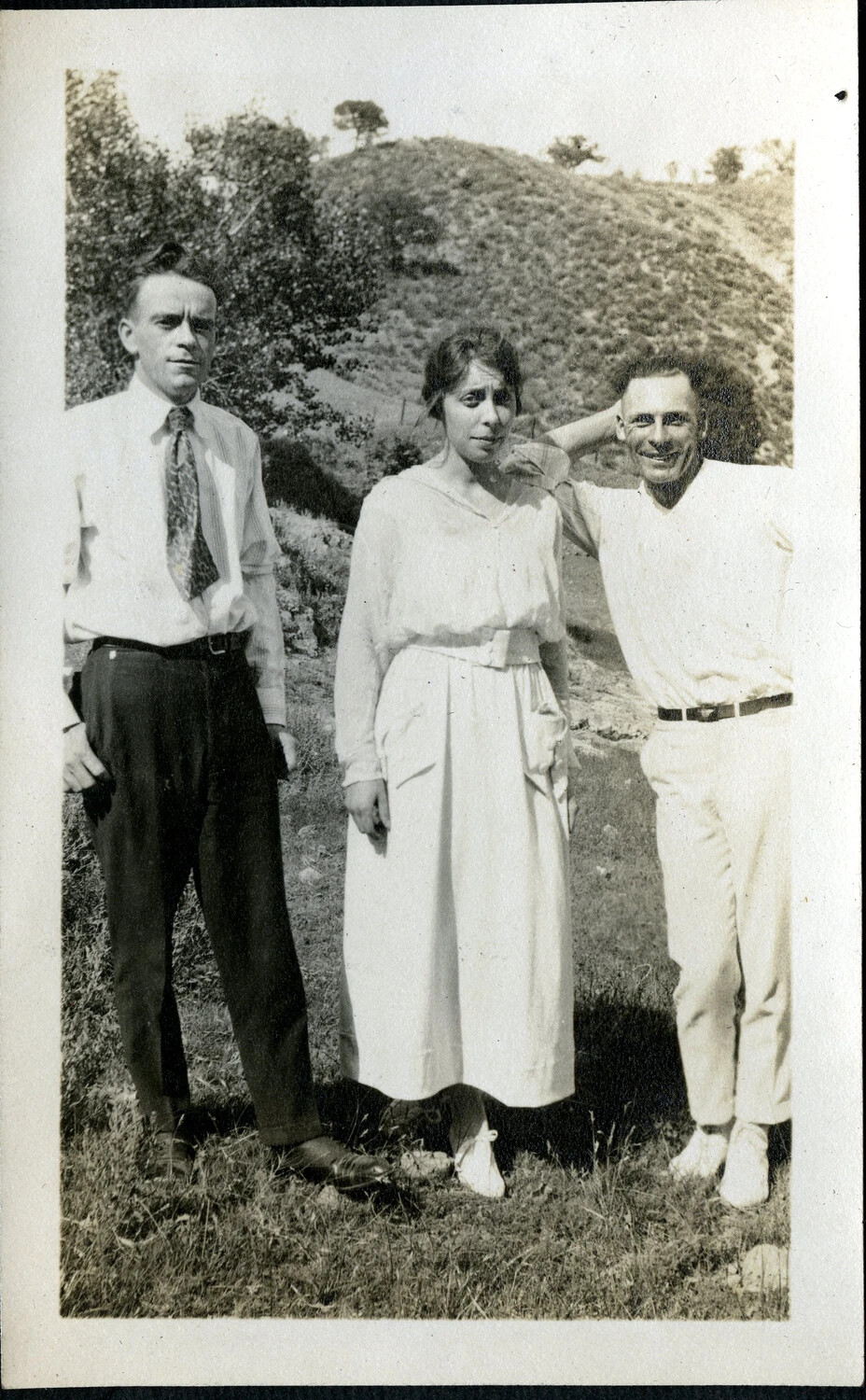 Three Civilians Posed on a Grassy Hillside, Early 20th Century