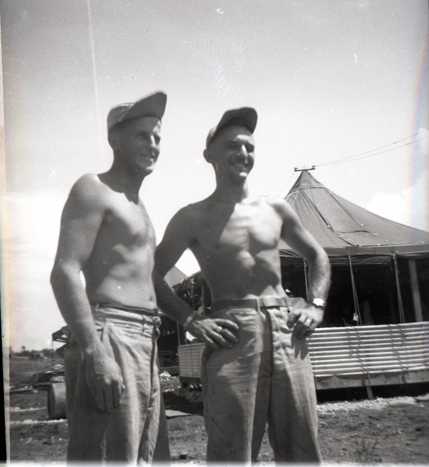 Portrait of Two Shirtless Servicemen at Camp, WWII Pacific Air Base