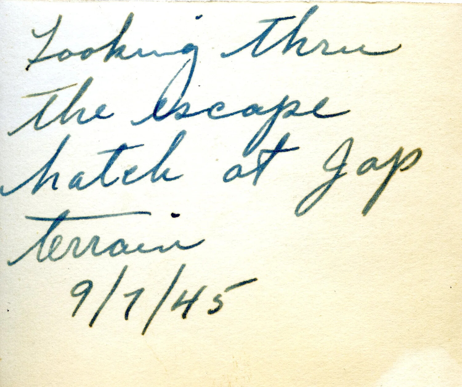 Handwritten Caption Card: 'Looking Thru the Escape Hatch at Jap Terrain, 9/7/45'