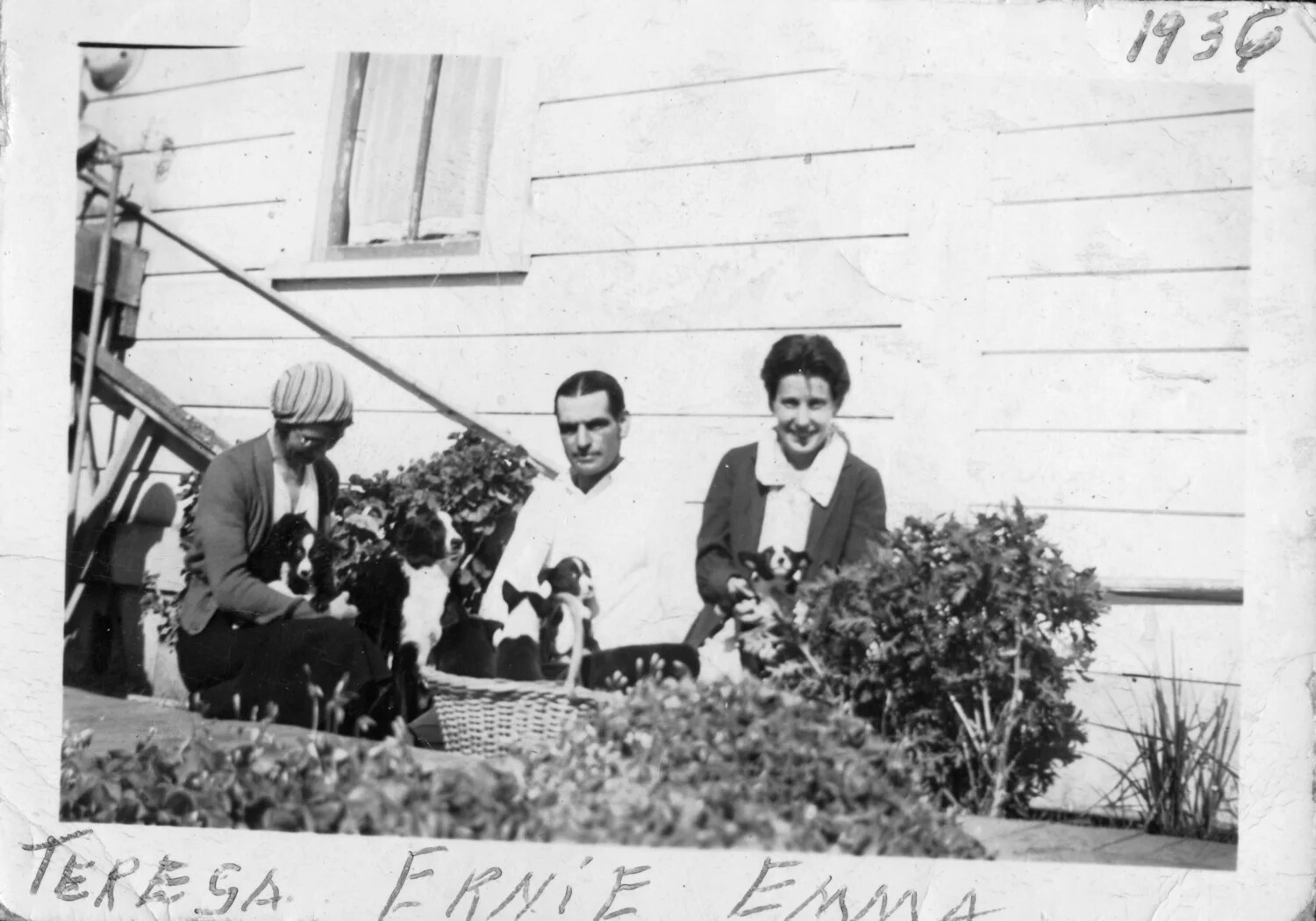 Teresa, Ernie, and Emma with Puppies in the Garden, Presidio Album, dated 1936