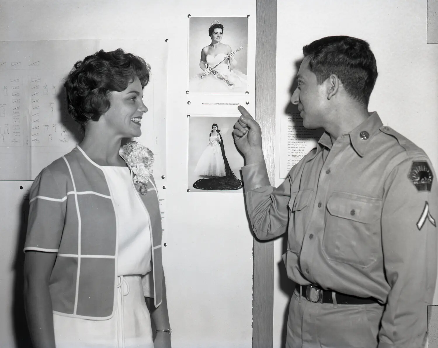 Miss California Shown Her Own Pageant Portraits by a Guardsman, Company Orderly Room, July 1960
