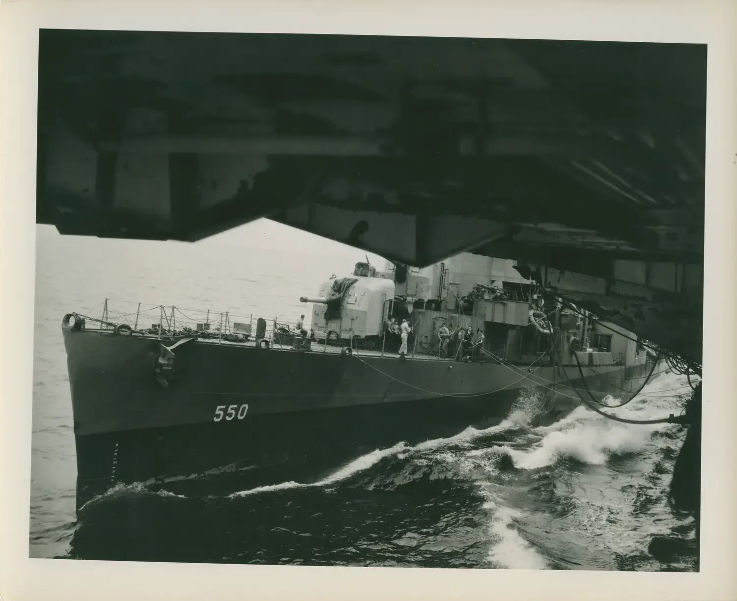 Destroyer Escort DE-550 Alongside USS Petrof Bay (CVE-80) During Underway Replenishment, WWII