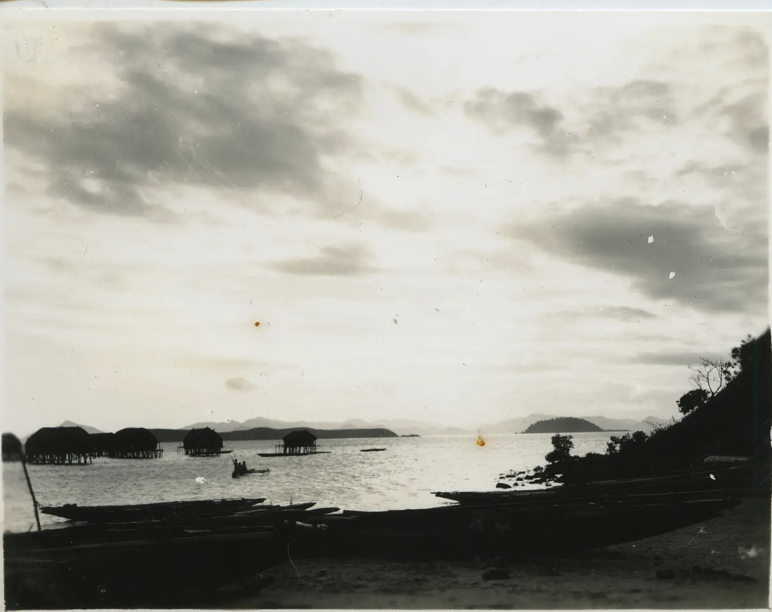 Silhouette View of Stilt Village and Canoes at Dusk, Pacific Islands