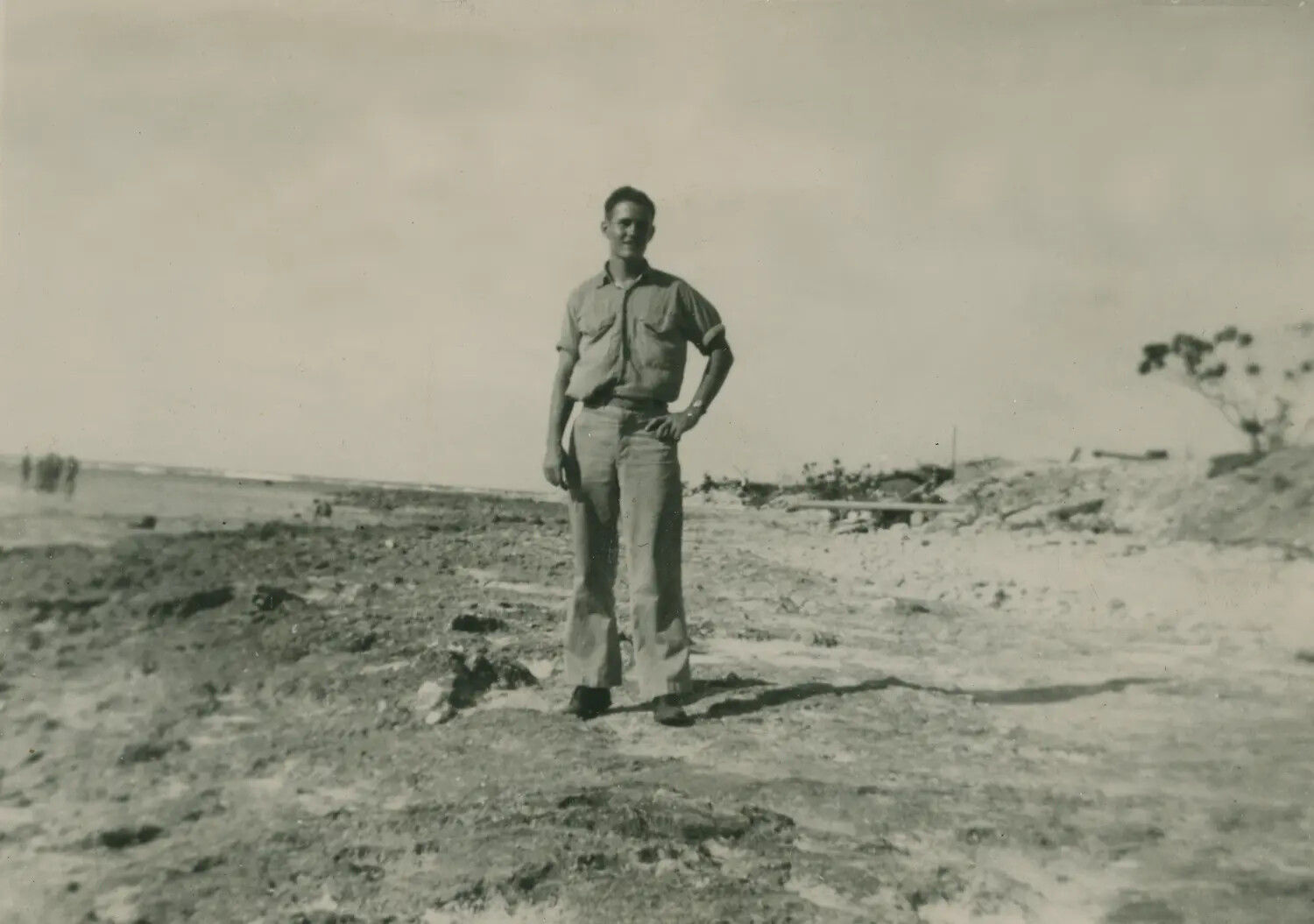 US Serviceman on War-Damaged Pacific Beach, WWII