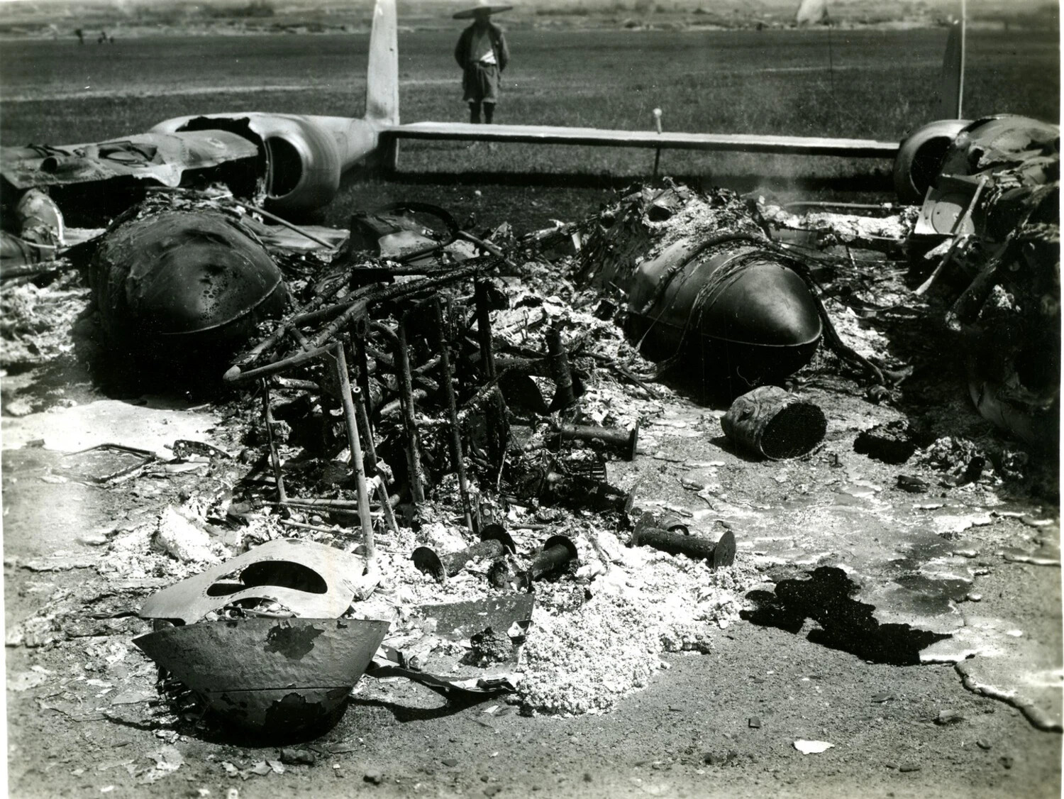 Burned Wreckage of Twin-Engine Aircraft on Airfield, Burma Theater, World War II