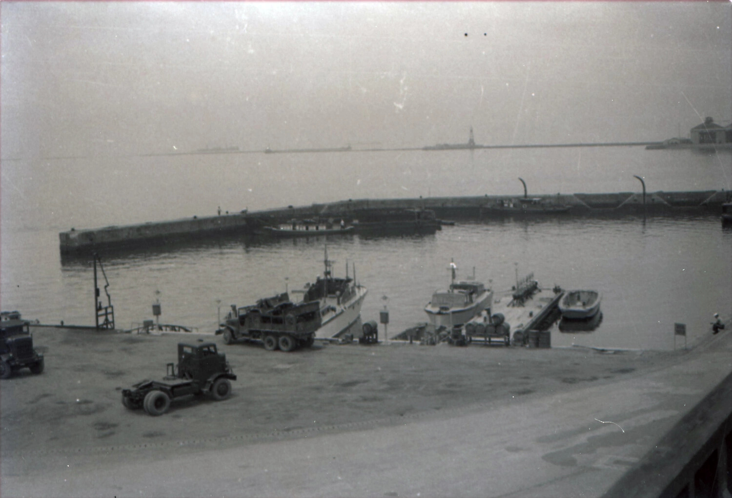 Naval Harbor Scene with Boat Trailers and Small Craft, likely Yokosuka, Japan, early 1950s