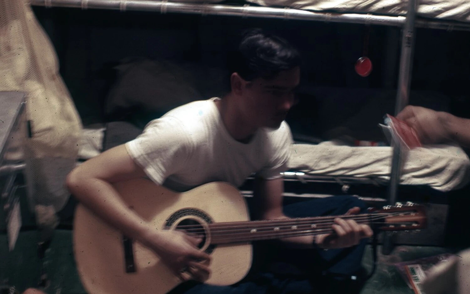 Sailor Playing Guitar in Berthing Compartment, USS Ticonderoga (CVA/CVS-14), Vietnam War Era (est. mid-to-late 1960s)