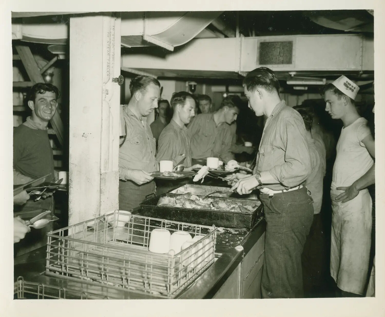 Sailors in Chow Line at Serving Counter, USS Petrof Bay (CVE-80), WWII