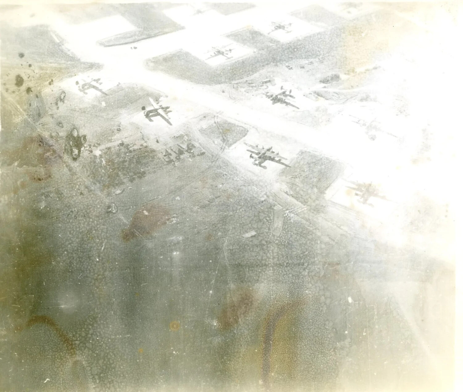 Aerial View of B-25 Mitchell Bomber Formation Over Airfield, Pacific Theater, WWII