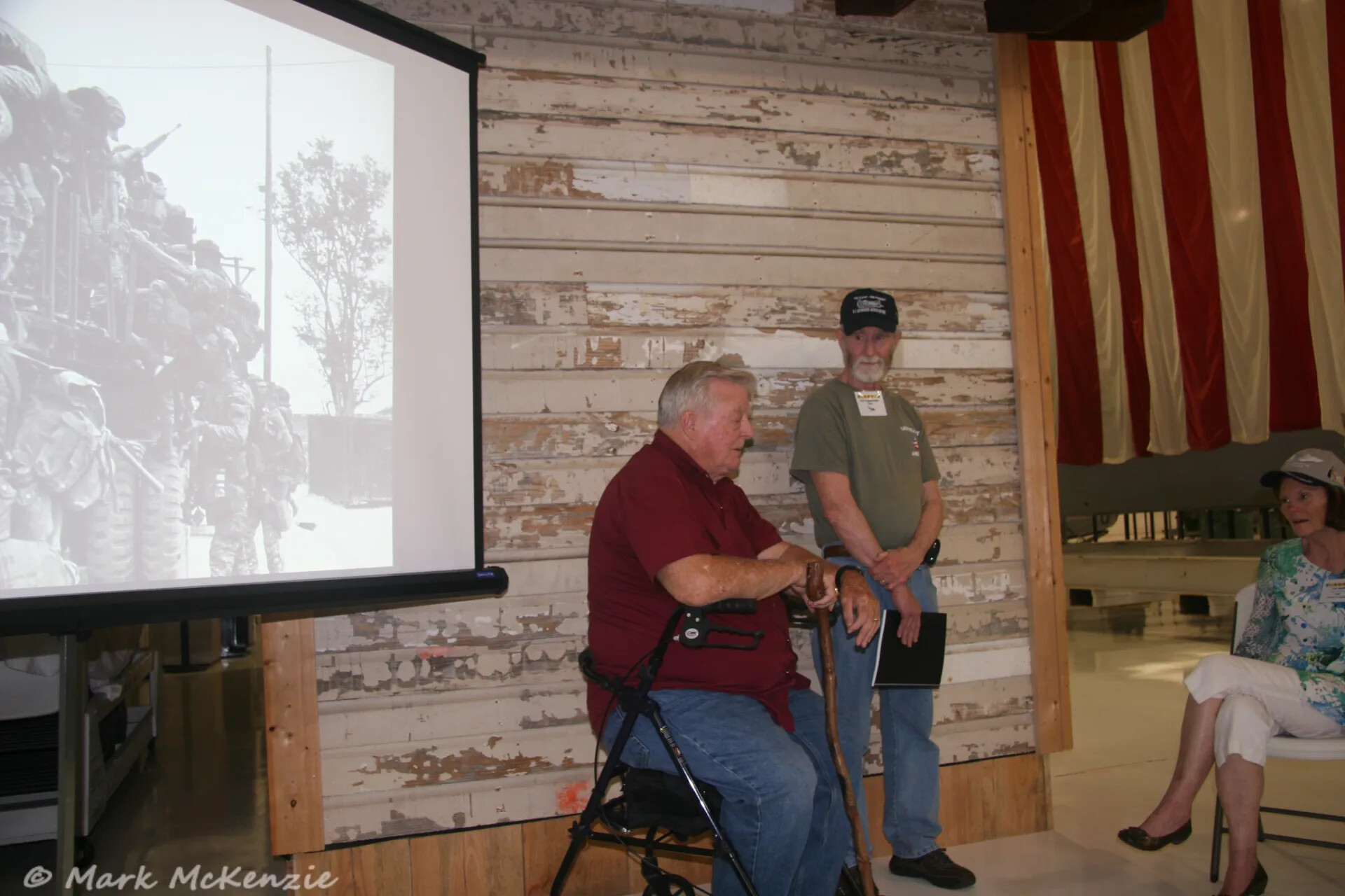 Veterans' Reunion Presentation with Archival Wartime Photo on Screen, Photographed by Mark McKenzie