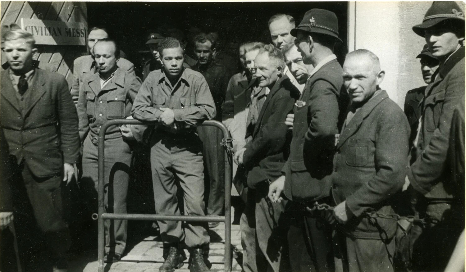 German Civilian Internees Under American Guard at Occupation Depot, Germany, c. 1945