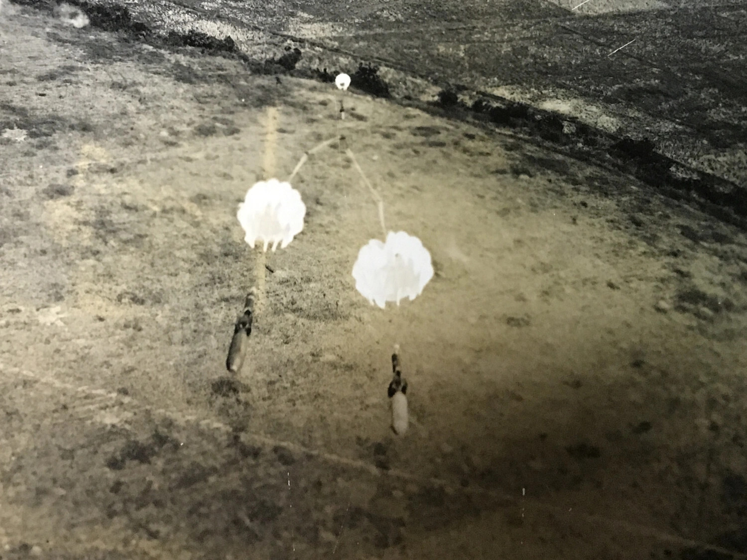 Parachute-Retarded Fragmentation Bombs Falling on Ground Target