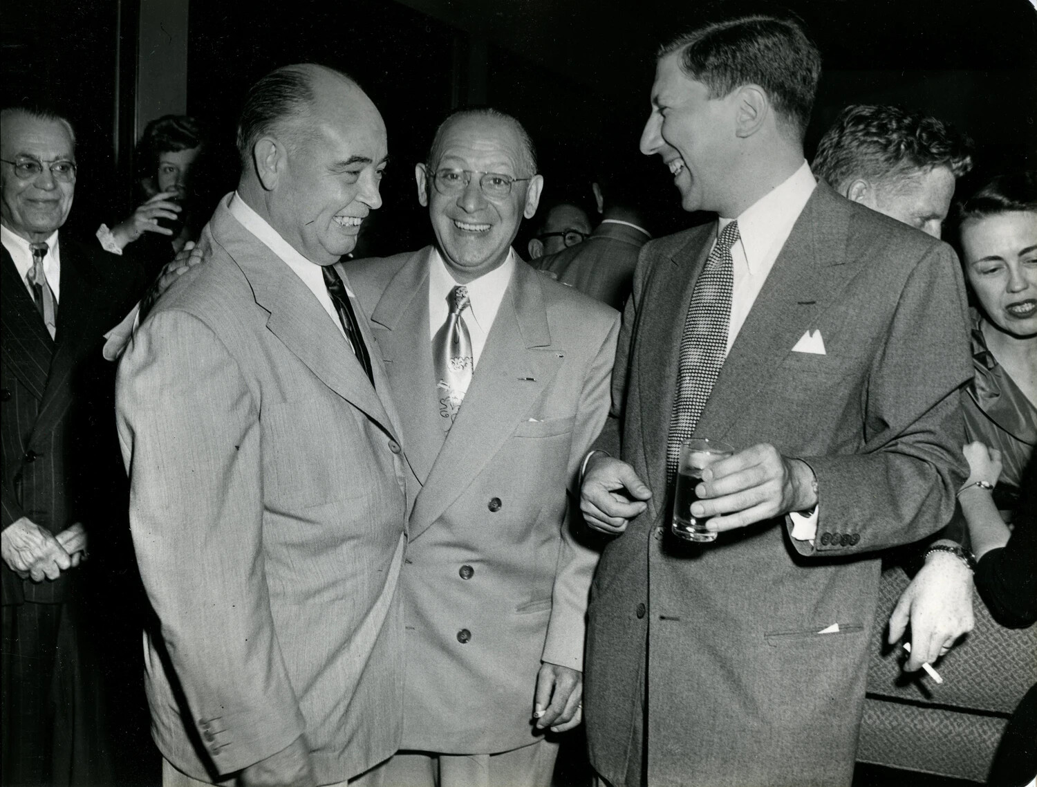 Jovial Group of Convention Attendees Sharing a Laugh, Late 1940s Reception