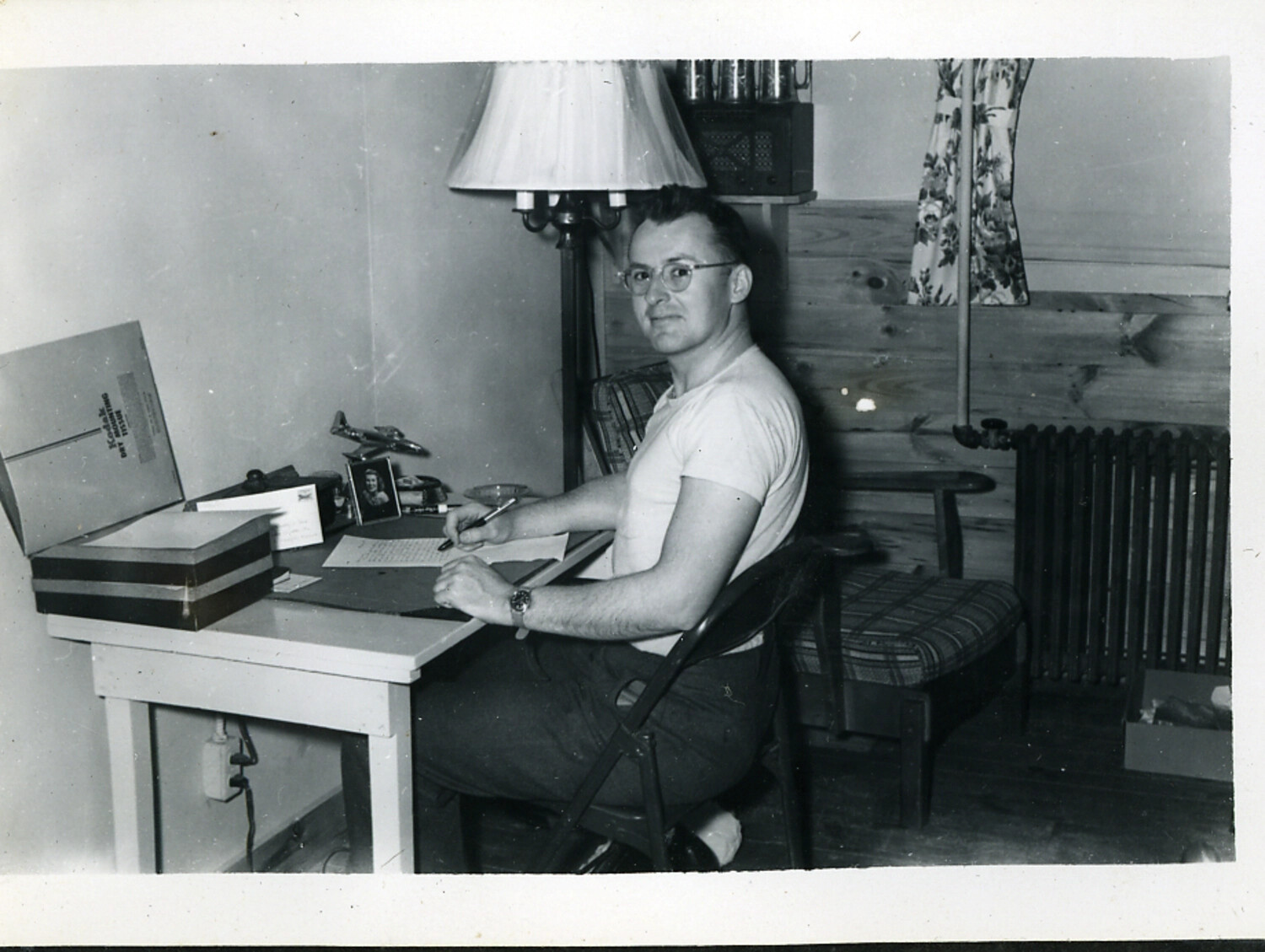 Serviceman Writing a Letter at Barracks Desk
