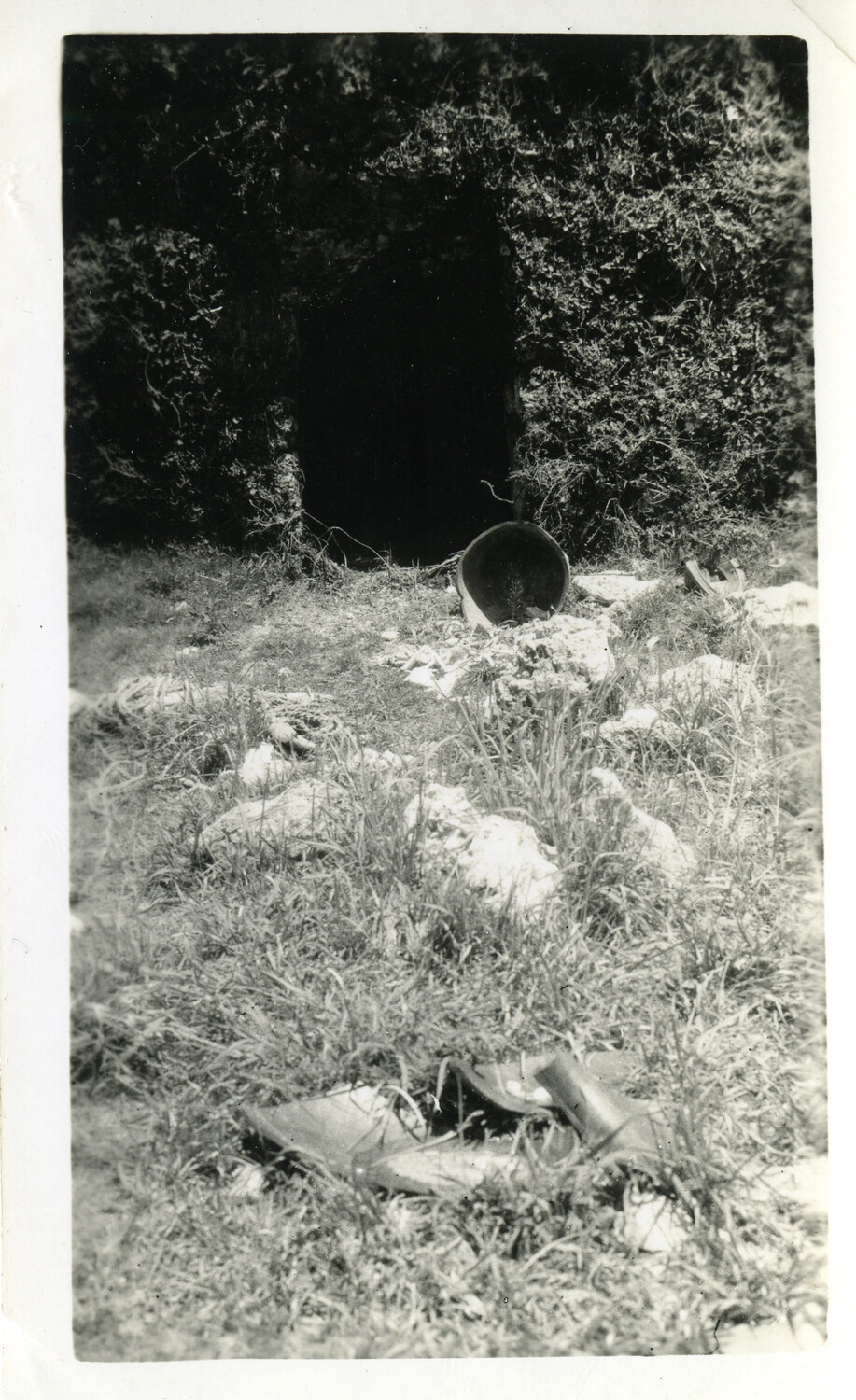 Abandoned Cave Entrance with Discarded Helmet and Boots, Okinawa Campaign