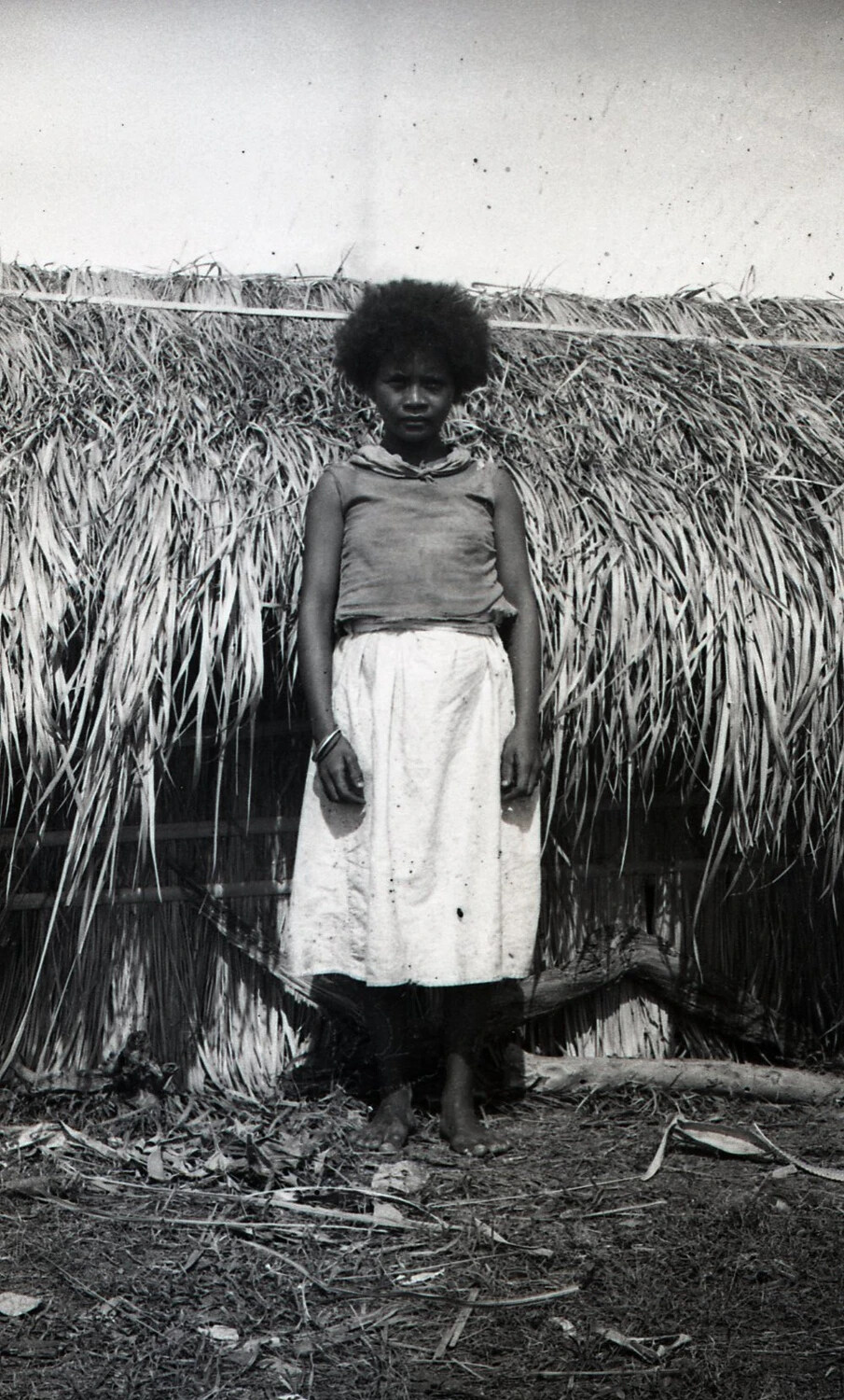 Portrait of a Young Filipino Girl in Front of a Thatched Hut Wall, Luzon, Philippines, WWII