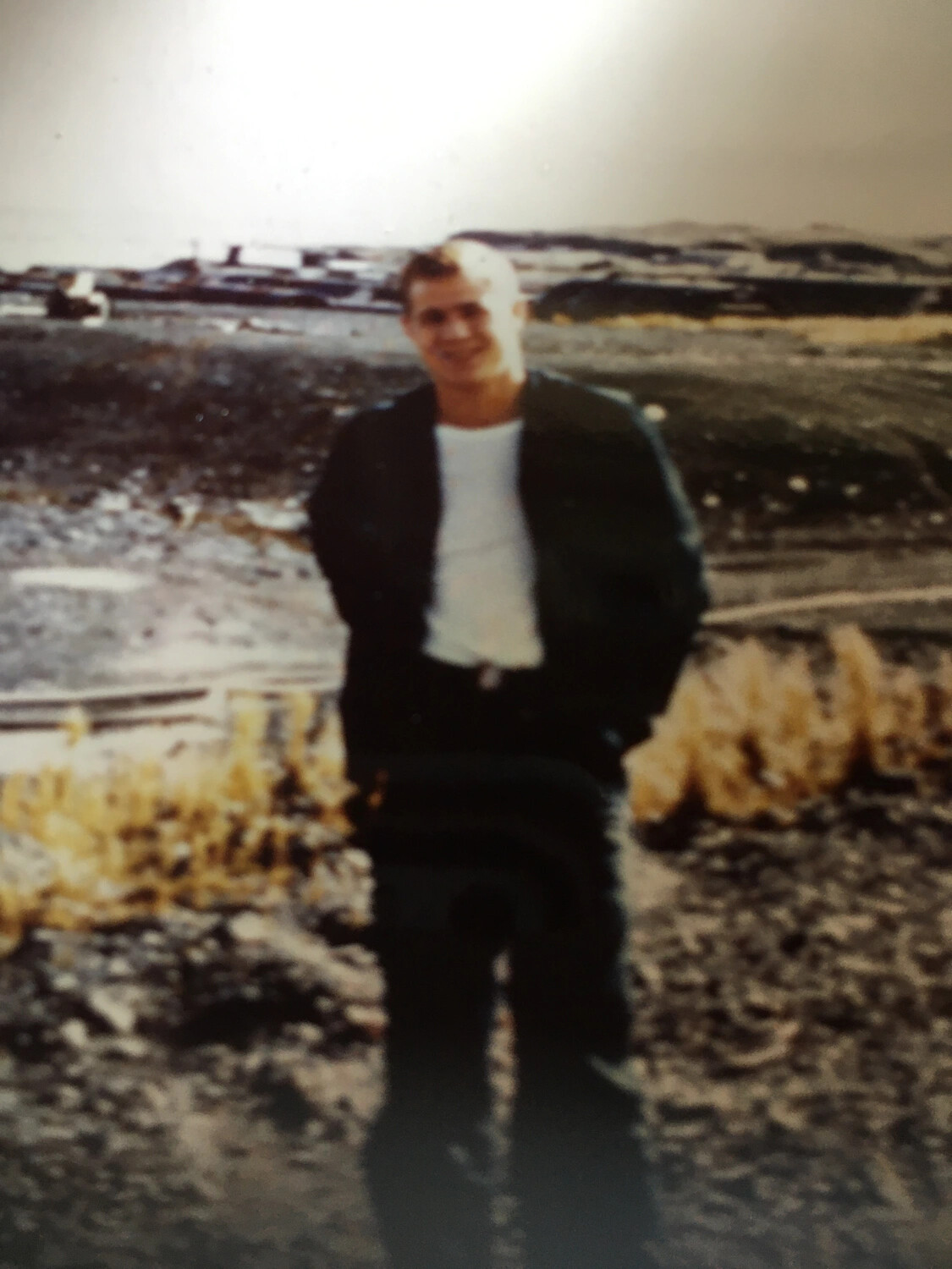 Portrait of a Young Man on a Rocky Shoreline, Korean War Era (Bancroft/Mounce Collection)