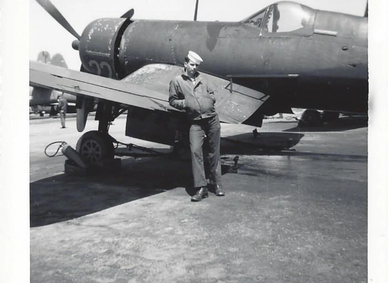 Sailor Beside Folded-Wing F4U Corsair Fighter, Naval Air Station Jacksonville