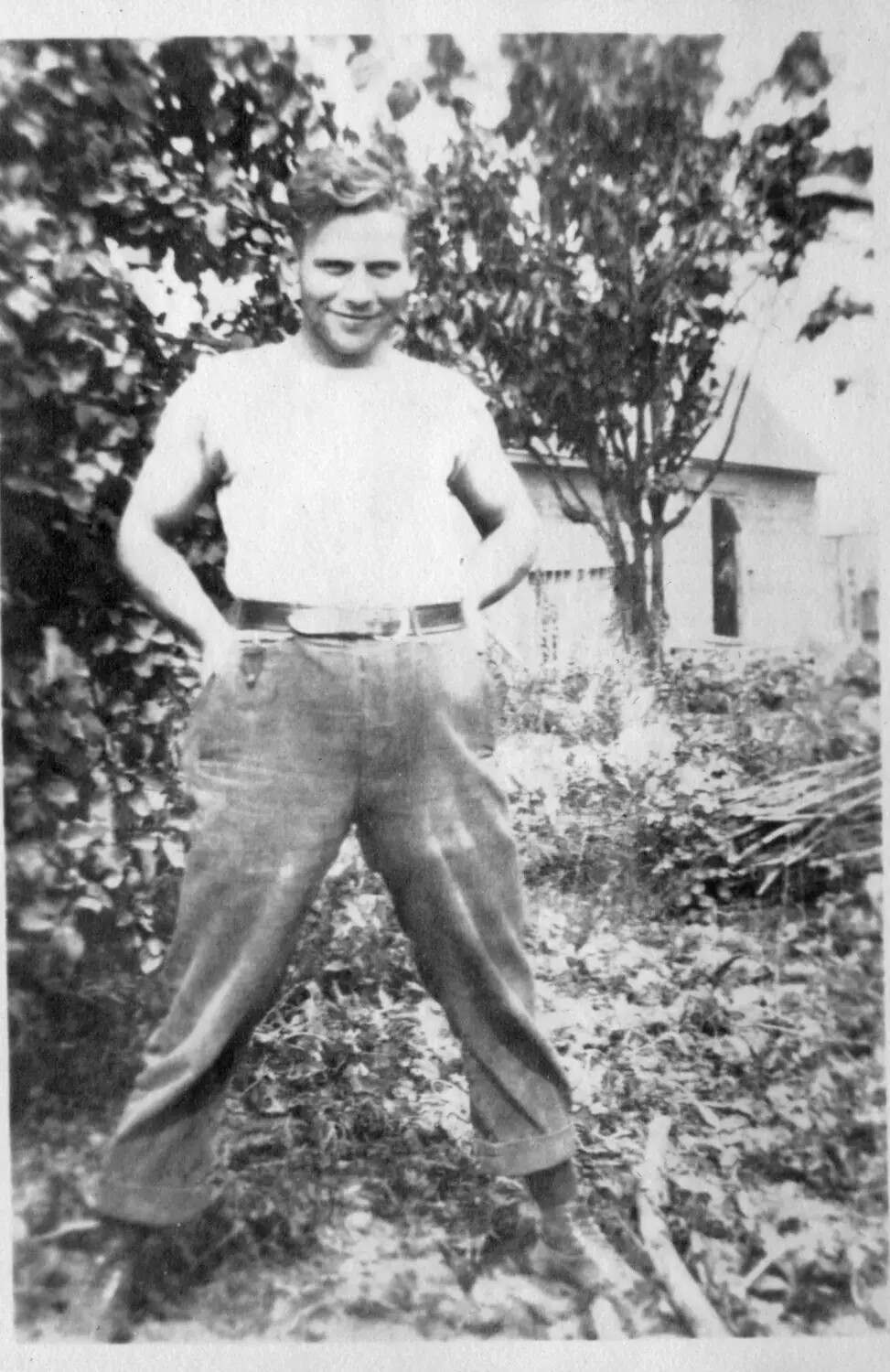 Informal Portrait of a Young Man in a Backyard Garden