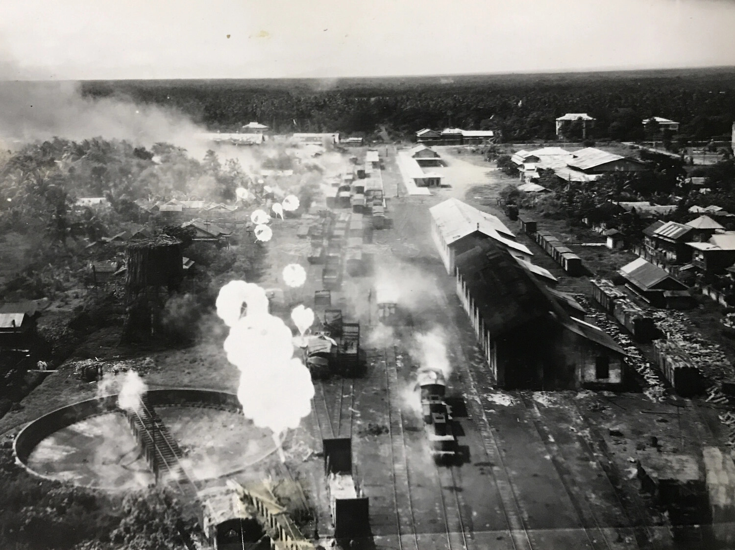 Low-Level Strike Photograph of Railway Yard and Roundhouse Under Parafrag Attack, Philippines, 312th Bomb Group