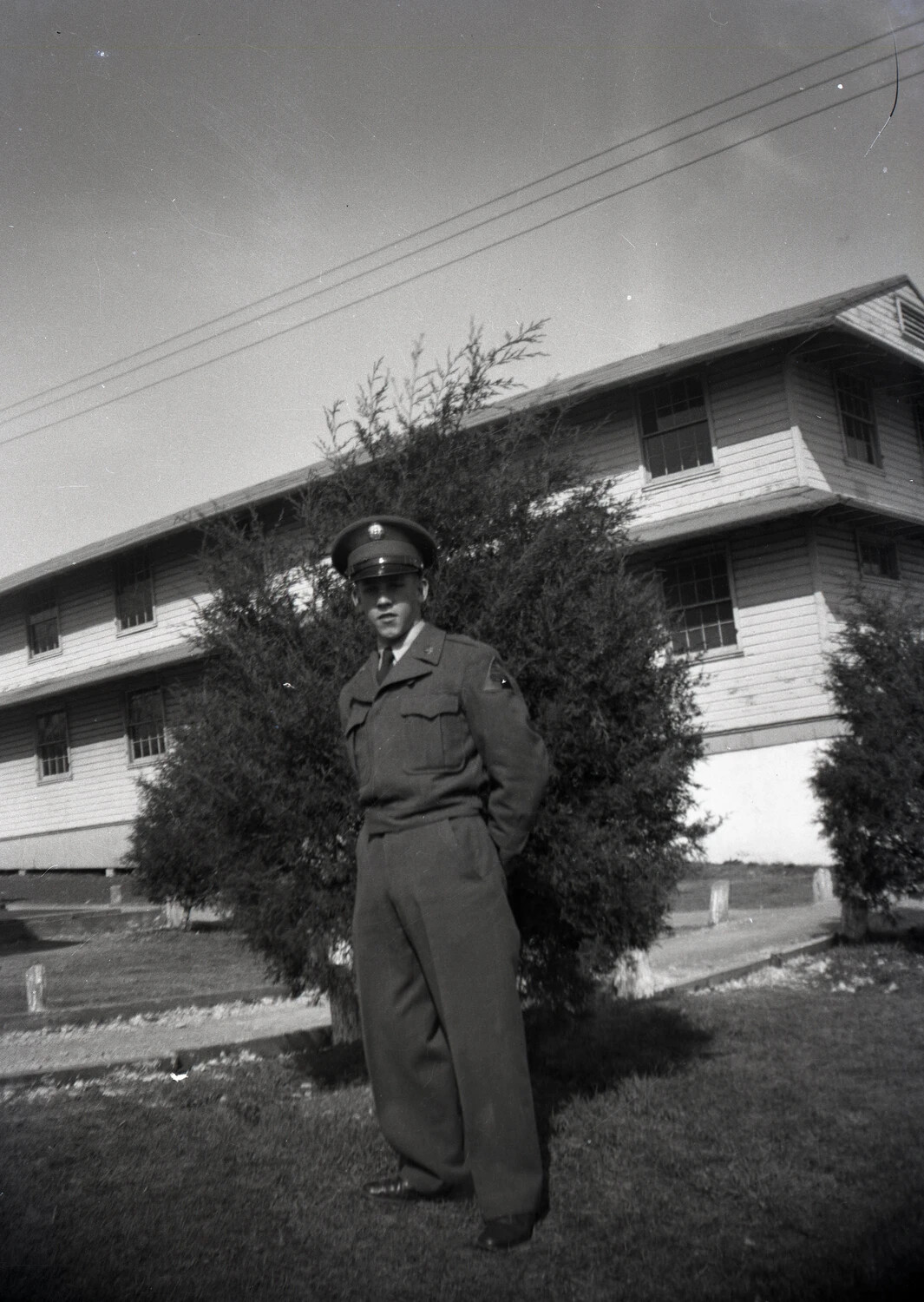 USAF Airman in Class A Uniform Posing Before Barracks, Randolph Field
