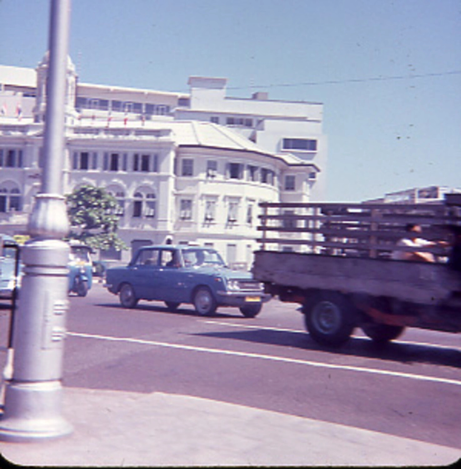 Street Scene with Colonial Building and Traffic, South Vietnam, Vietnam War Era