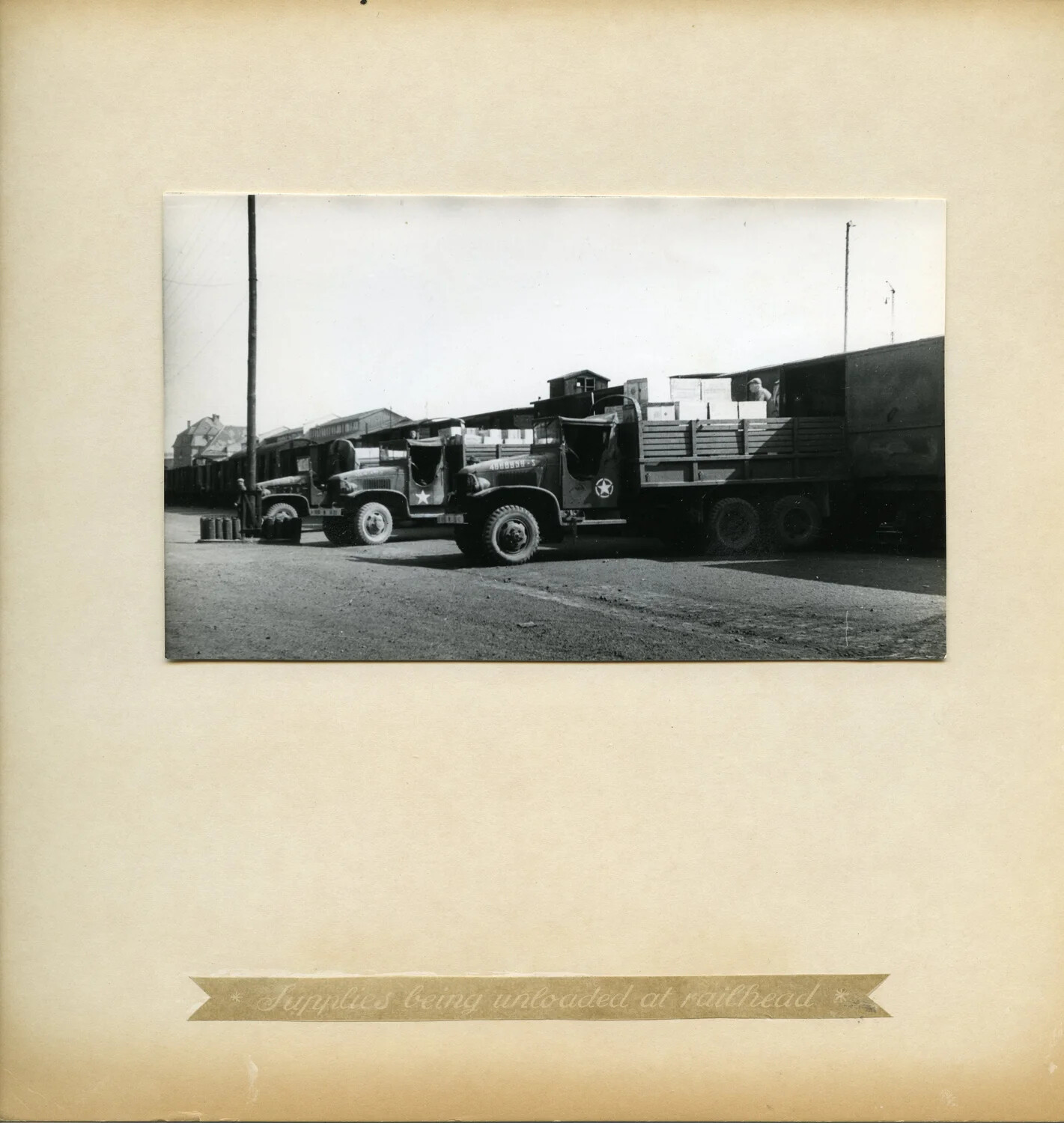 U.S. Army Cargo Trucks Unloading Supplies at Railhead, German Depot, Postwar Occupation Period