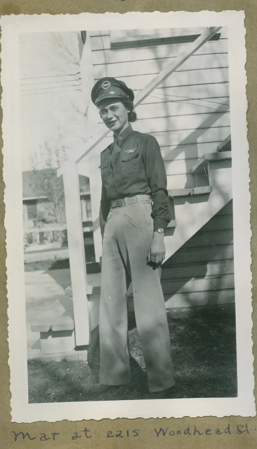 Woman in Aviation Uniform with Wings Insignia, Residential Portrait