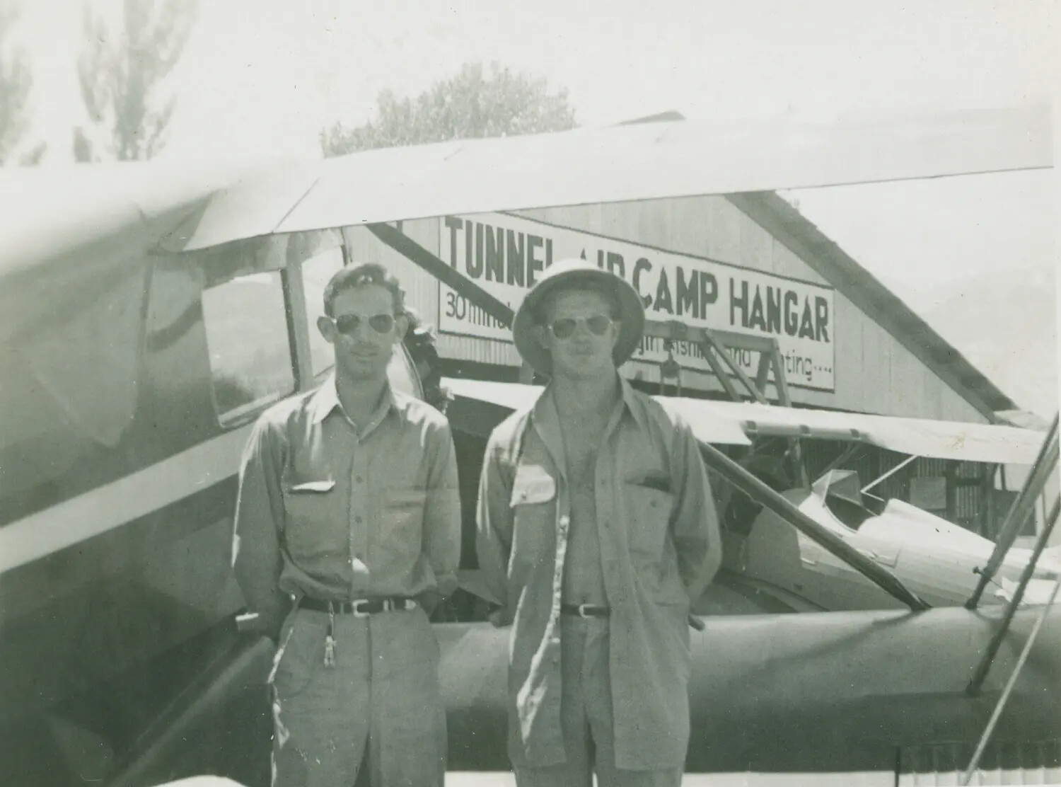 Two Men at "Tunnel Air Camp Hangar" with Light Aircraft, Edward P. McAleer Photo Album