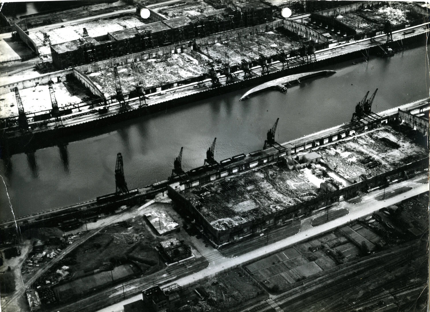 Aerial Reconnaissance View of Bomb-Damaged Canal Dockyards, Germany, 1945