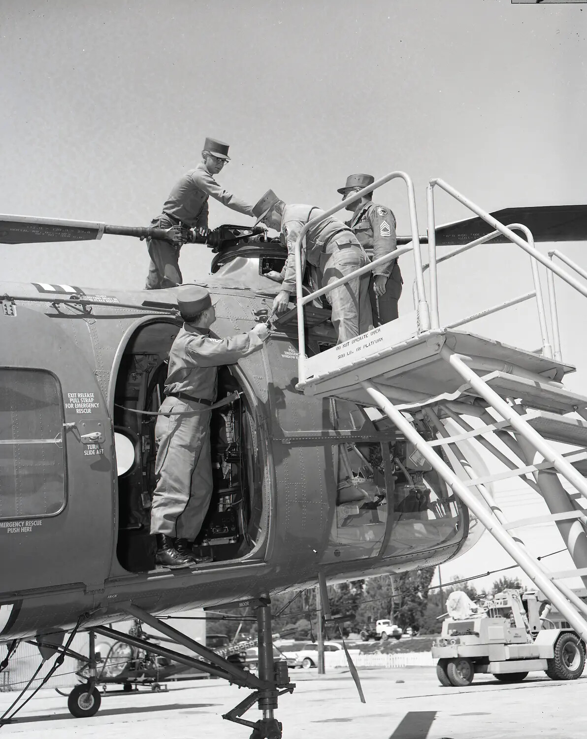 National Guard Ground Crew Servicing H-19 Chickasaw Helicopter on Airfield Ramp
