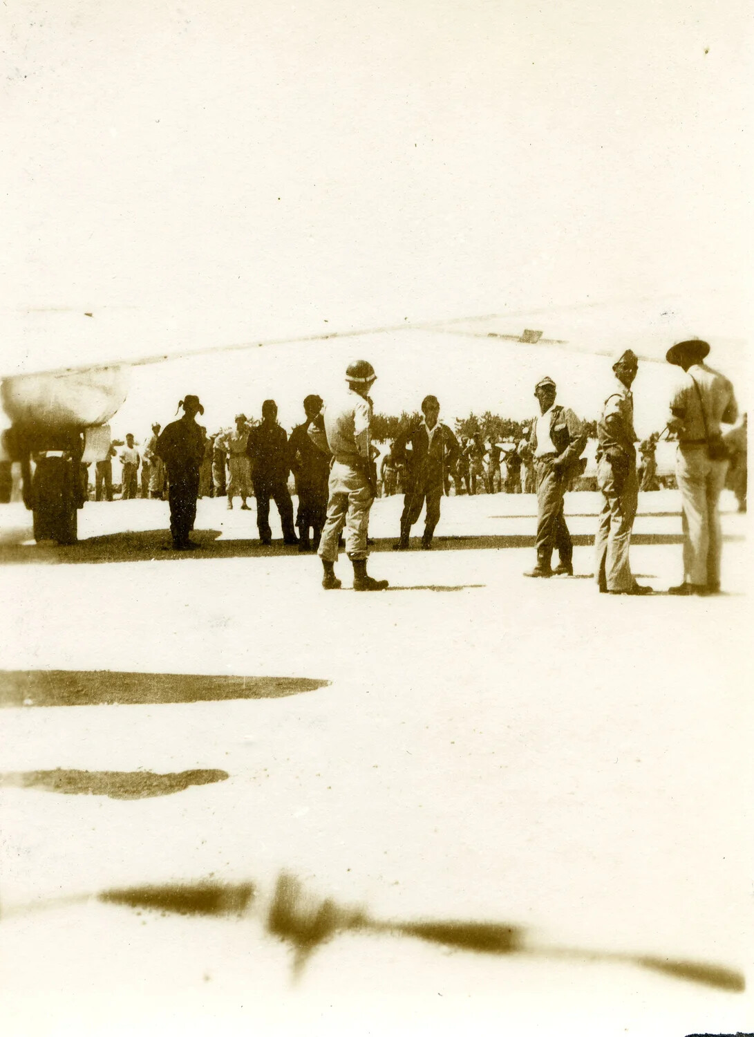 Servicemen Gather Near Envoy Aircraft on the Tarmac, Ie Shima, August 1945
