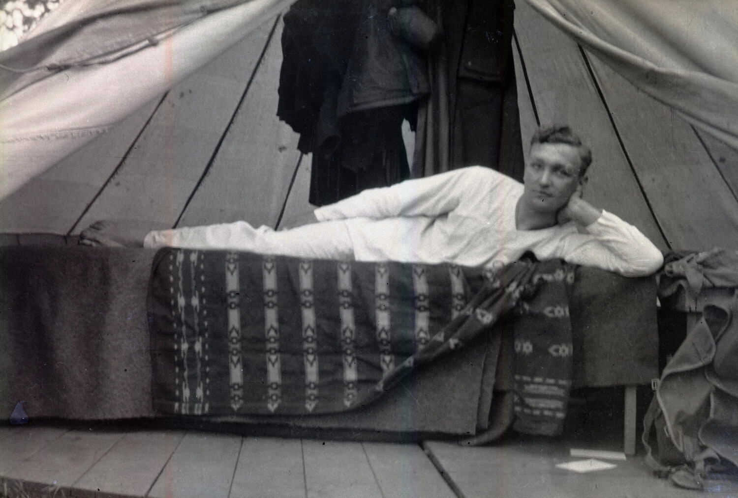 Serviceman Resting on Cot in Tent Quarters – WWI France/England, Scott Field Collection