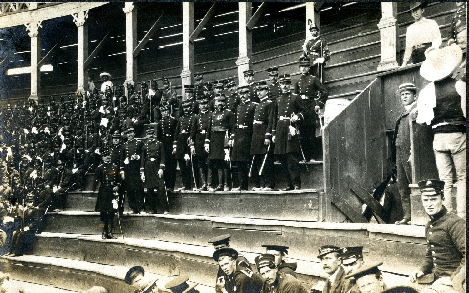 Mexican Army Officers and Troops Assembled in the Grandstand at a Bullring, with U.S. Navy Sailors Looking On, c. 1898-1910