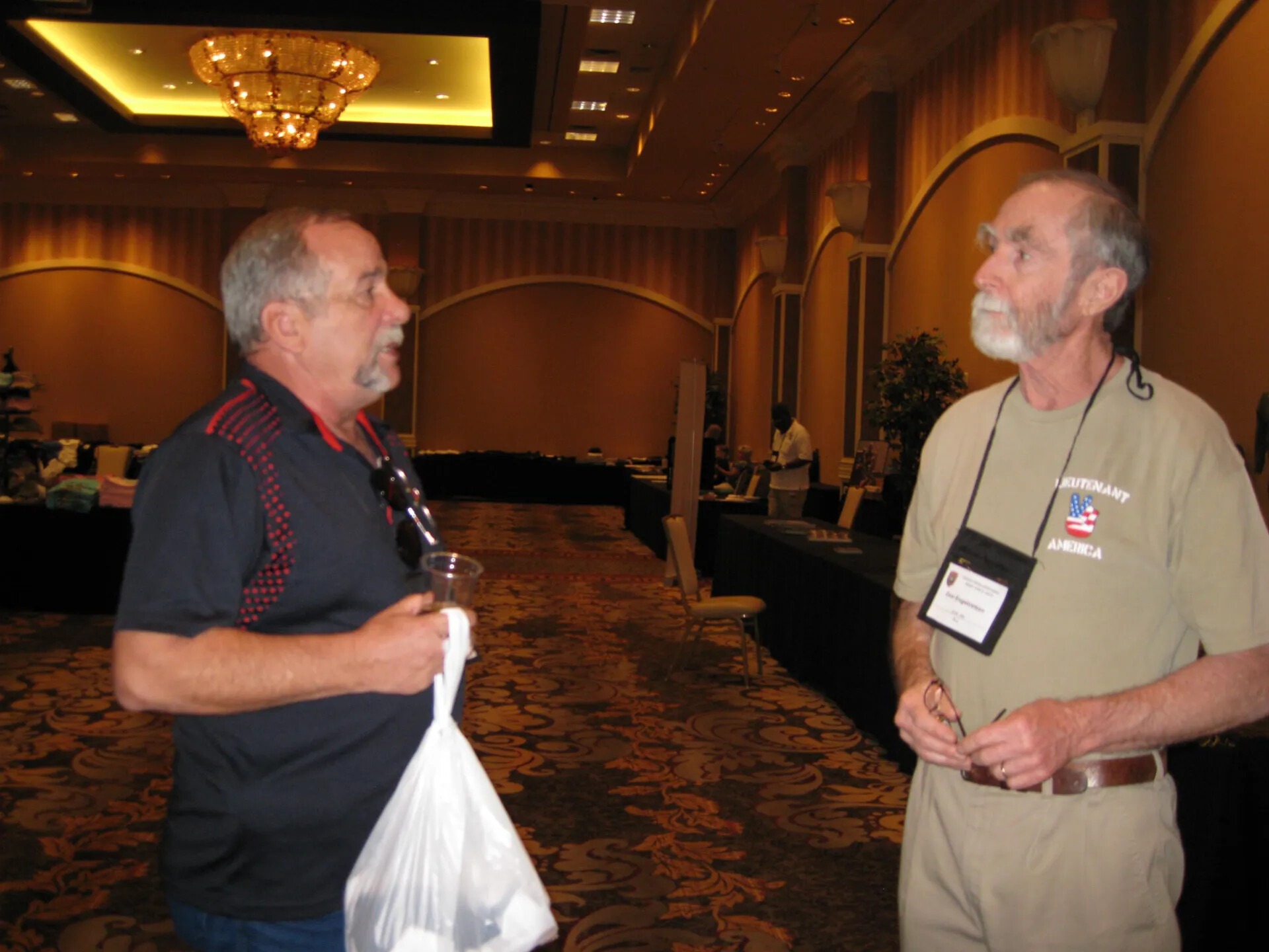 Don Engebretsen and an Attendee on the Vendor Aisle, SOAR XXXVII, Las Vegas, 2013 (second exposure)