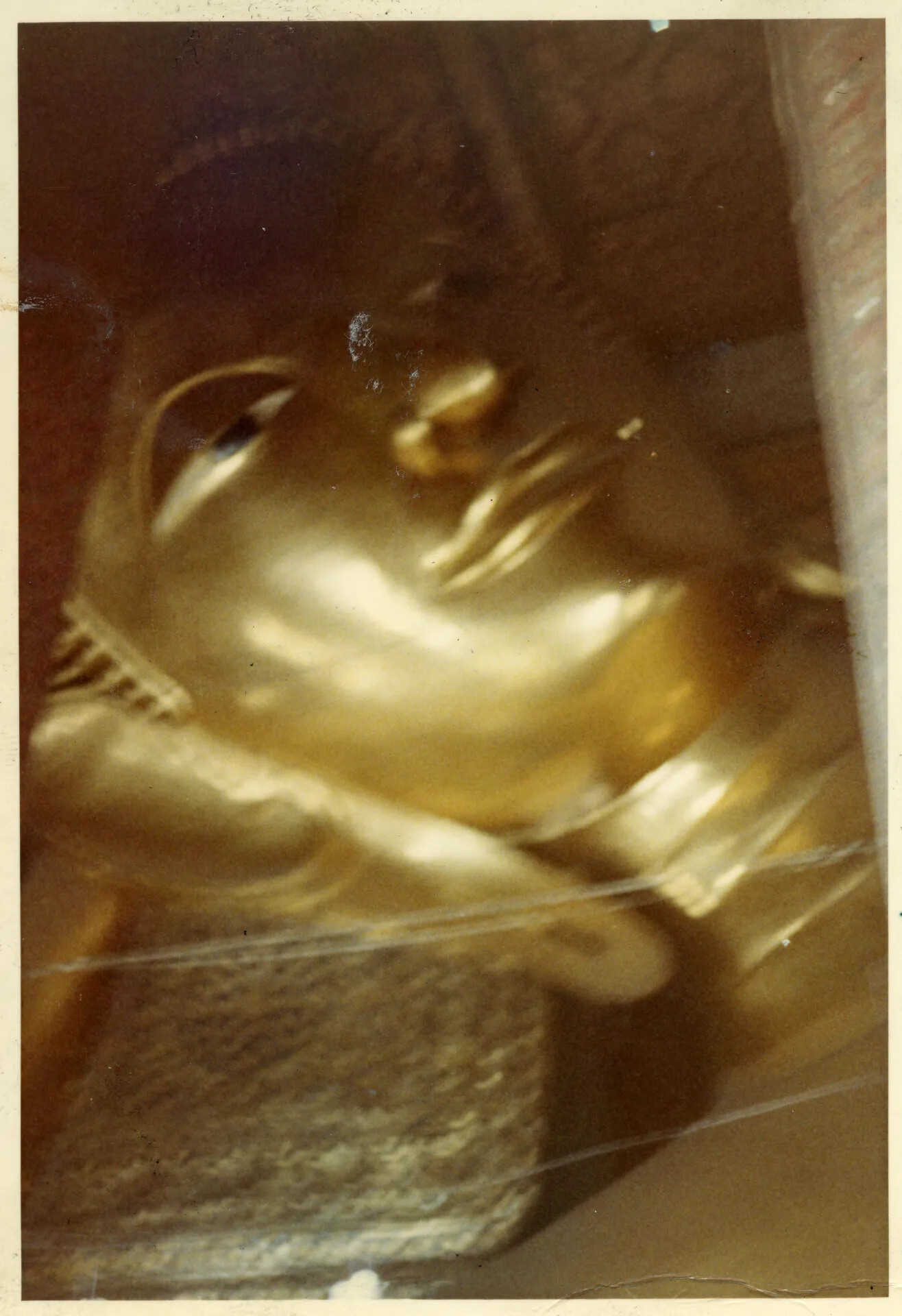 Blurred Close-Up Detail of Gilded Buddha Statue, Bangkok Temple